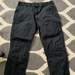 Men's older Carhartt carpenter pants